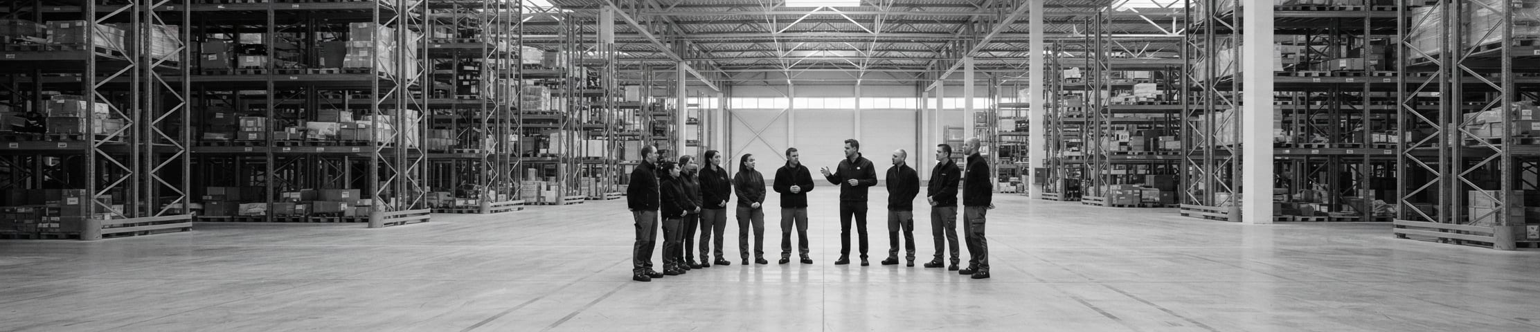 Illustration of a team briefing in a logistics facility